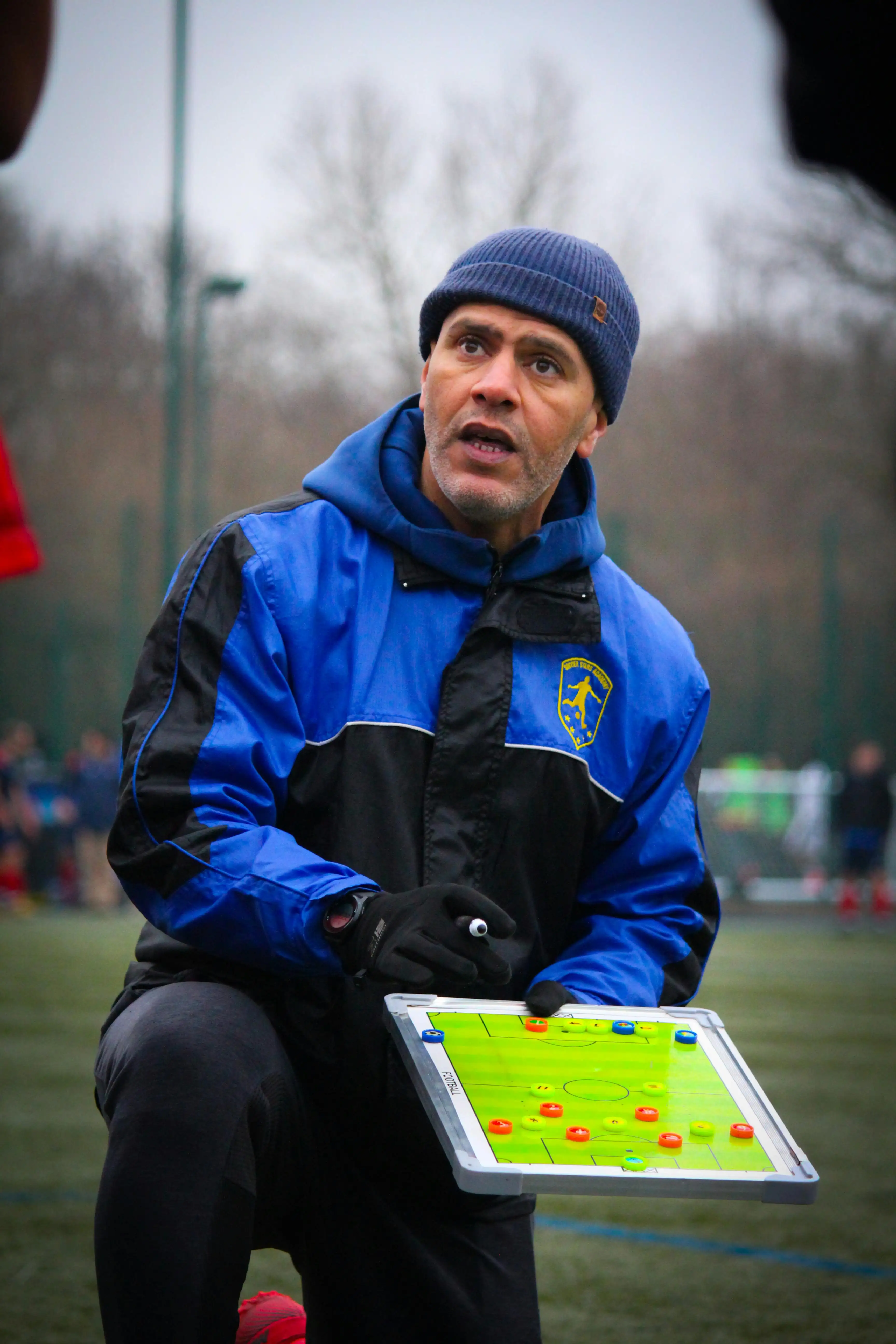 Football tactics board representing tournament bankroll planning and match preparation